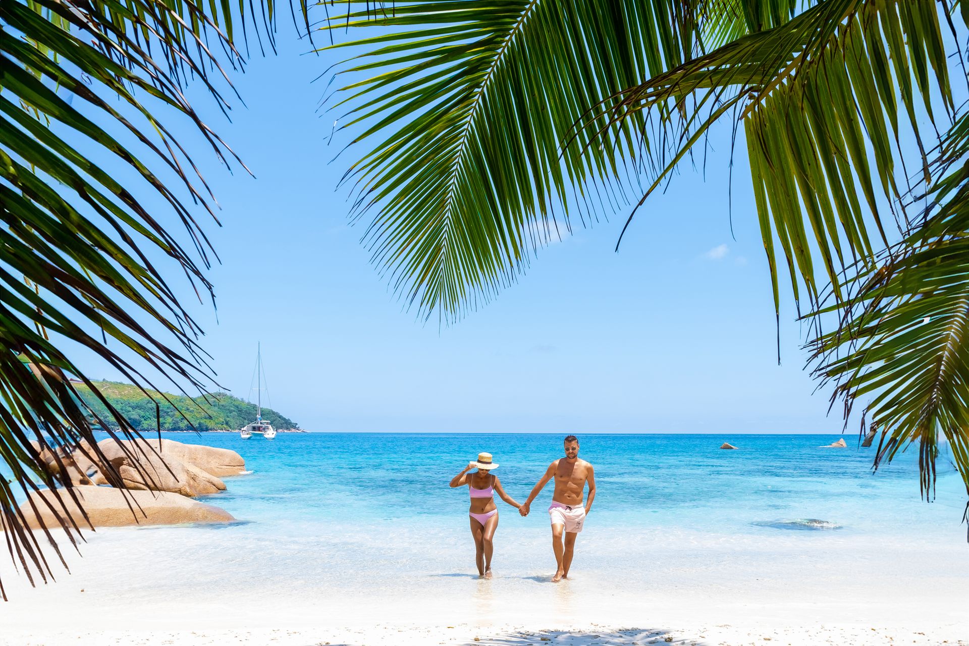 Couple lying in turquoise shallows